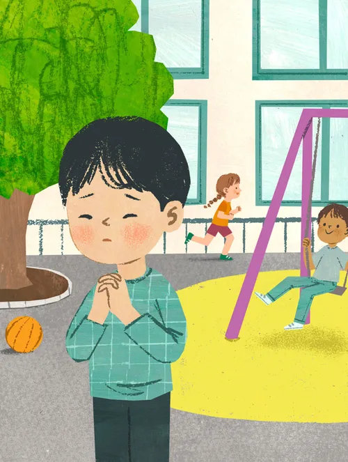 Boy praying on playground
