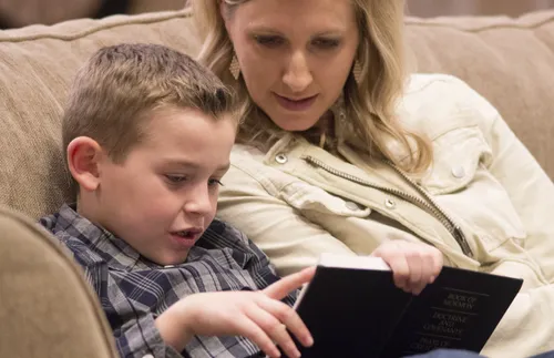 mother and children reading scriptures