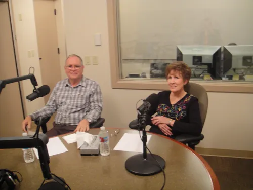 Screen capture from the program "Faith in Action."  Two people sitting at a table with microphones. Episode 19: Philipi Australia.