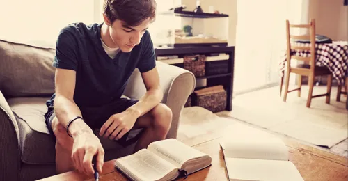 Young man studying scriptures