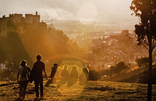 people sitting together in the sunshine