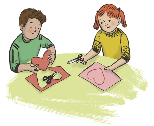 boy and girl cutting out paper hearts