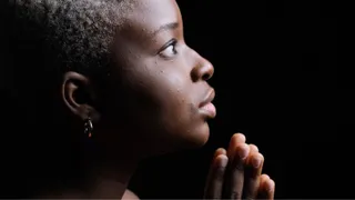 A young woman praying