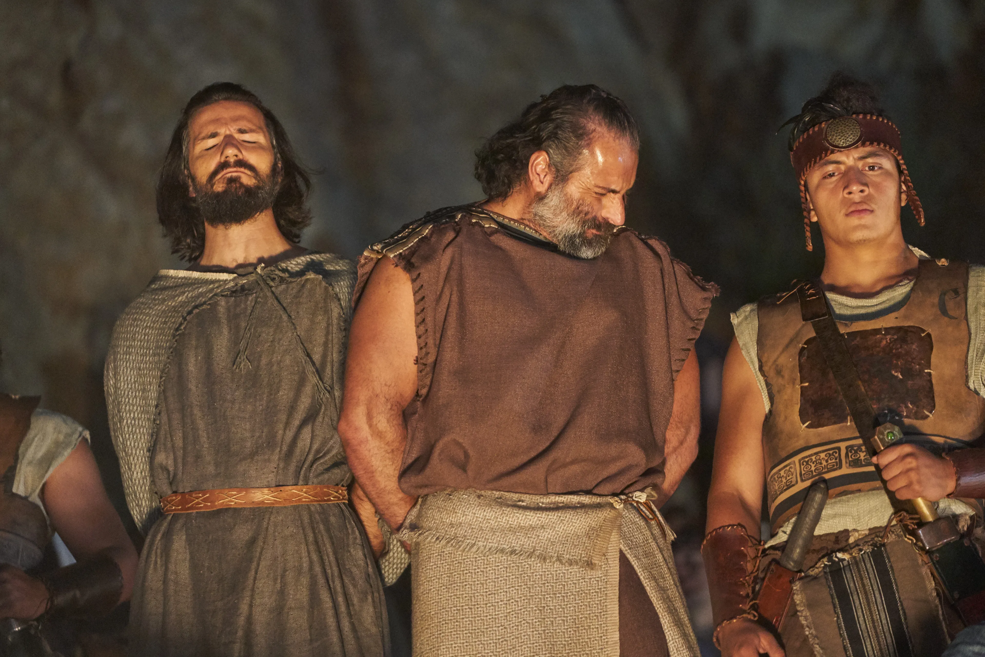 Alma the Younger and Amulek look away as the women and children of Ammonihah who believed their words are cast into the fire.