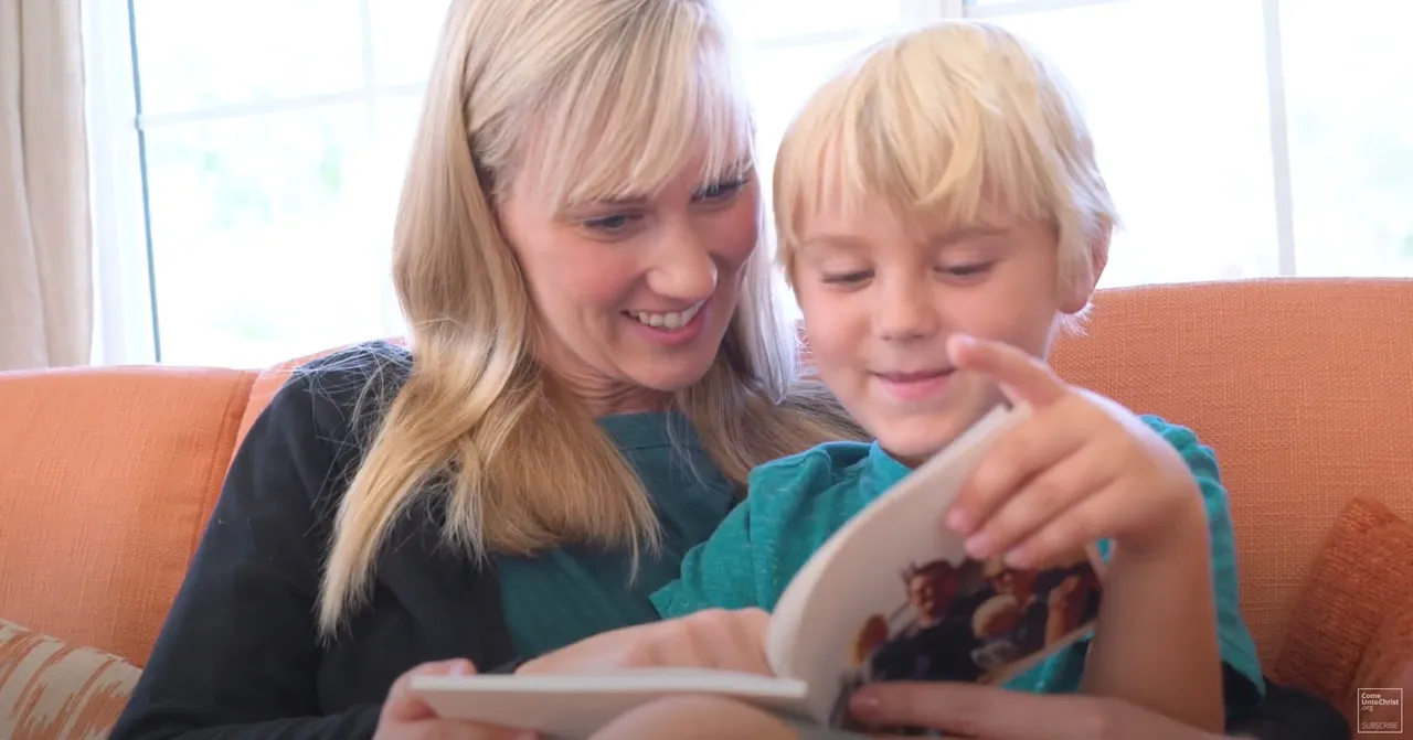 A mother reading a book with her young child