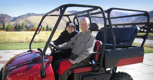 President and Sister Nelson in an all-terrain vehicle