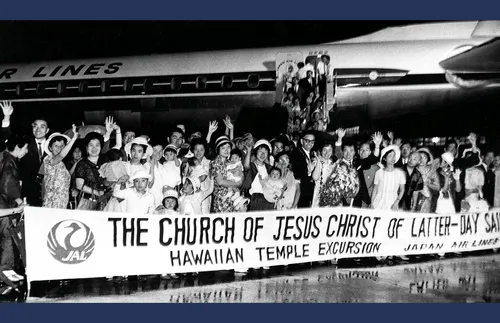 Japanese Saints are welcomed with flower leis.