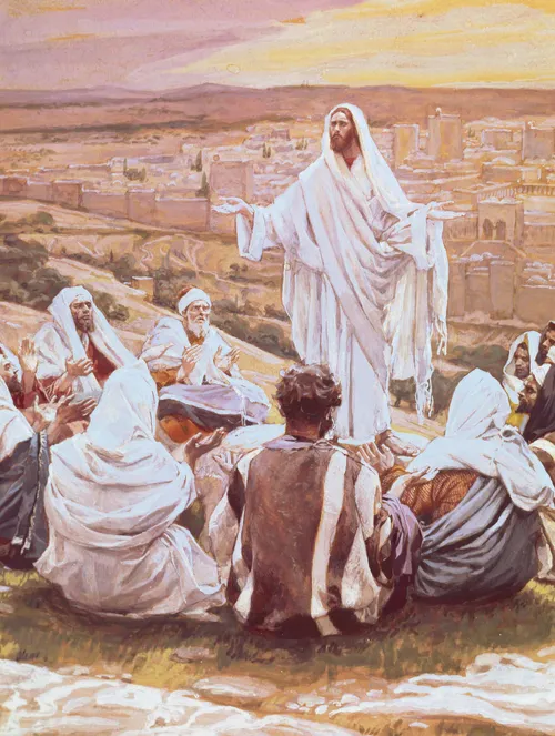 Christ in white robes, standing on a hillside near Jerusalem while His disciples sit around Him listening to His words.