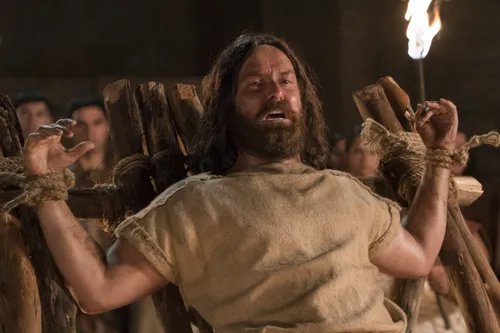 Abinadi is martyred. Guards and members of the court stand by and watch.