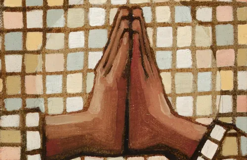 a person’s hands in prayer