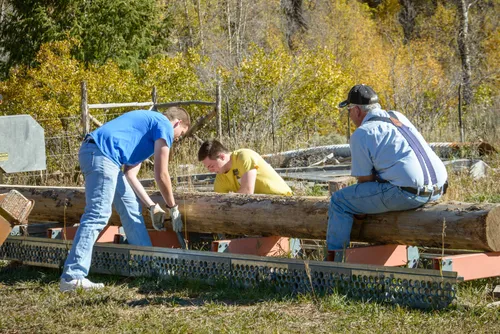 men bulding a fence