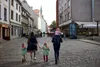 family walking down street