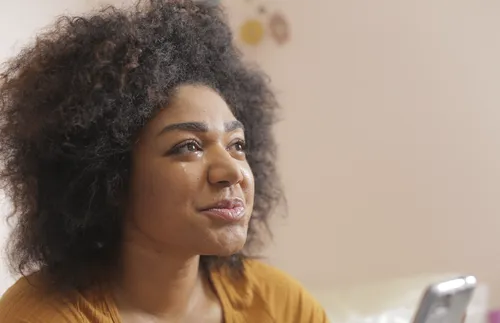 young woman holding phone