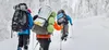 young men snowshoeing