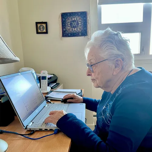 author sitting at a computer