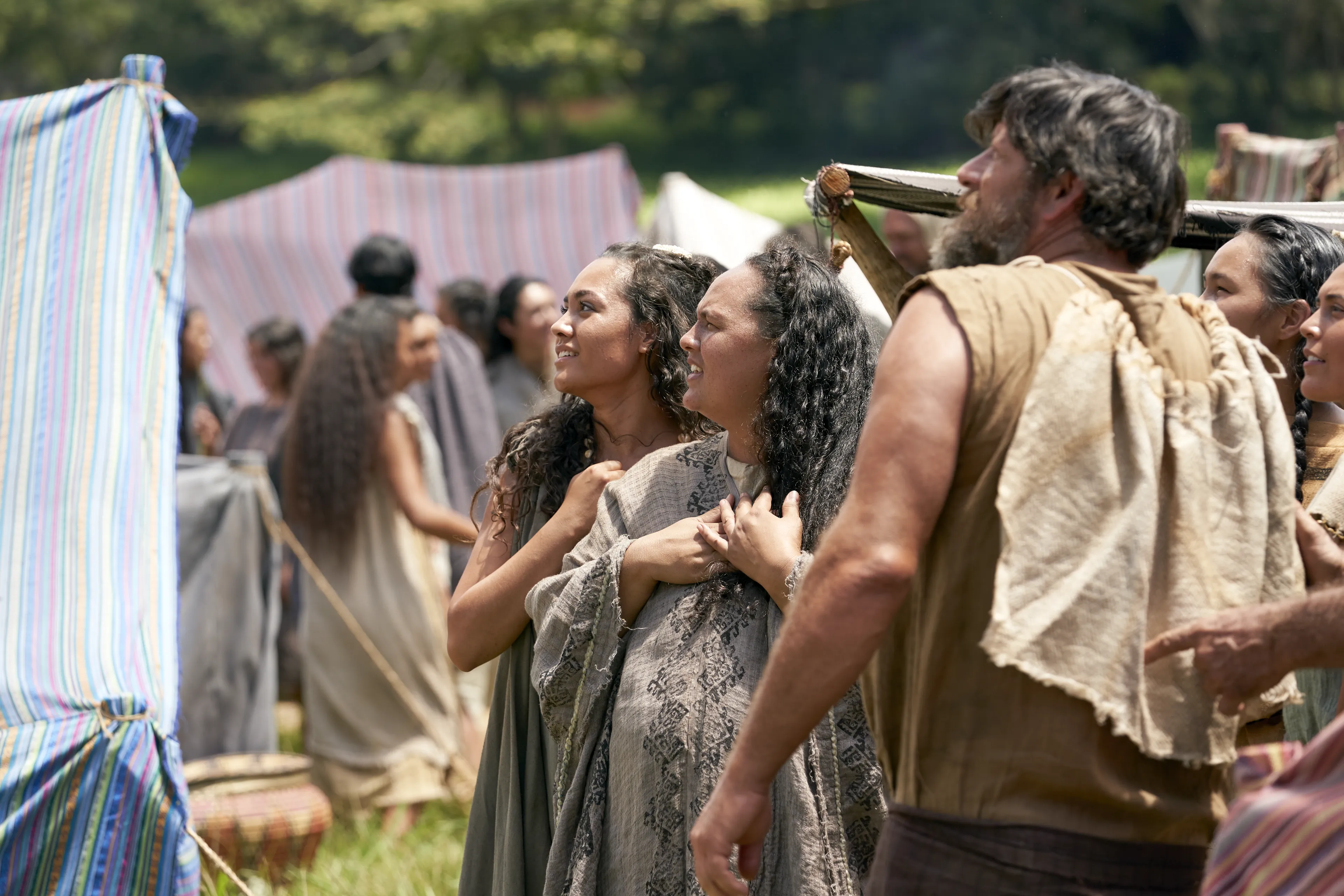 Men and women gather to listen to King Benjamin in the Land of Zarahemla.