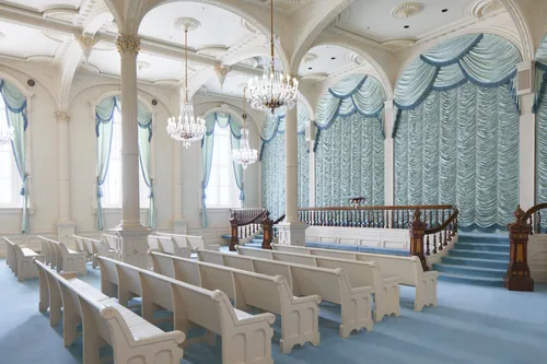Interior image of the Manti Utah Temple. The image features on the pre-Celestial Room. There are pews, chandeliers, and the Veil of the Temple.