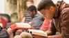 a group of youth reading scriptures together