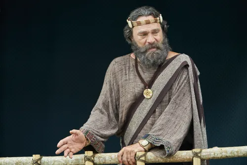 King Benjamin stands on a tower speaking to the Nephites in the Land of Zarahemla.