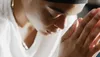 a woman praying