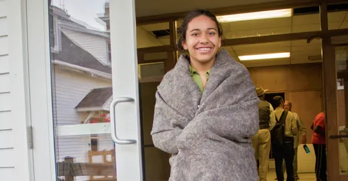 young woman in blanket