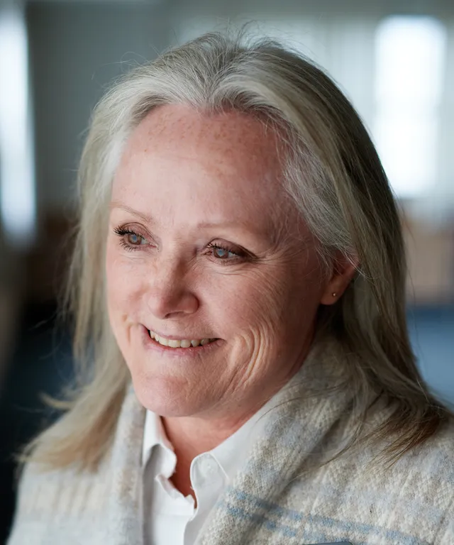 A senior missionary models appropriate dress and attire. She is wearing an approved outfit.