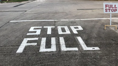“Full stop” written on roadway