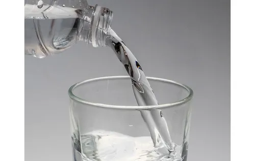 Glass being filled with water
