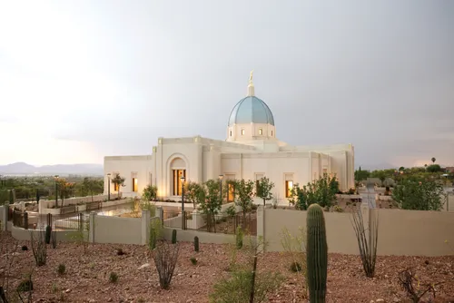 A photograph of the Tucson Arizona Temple against a cloudy sky.