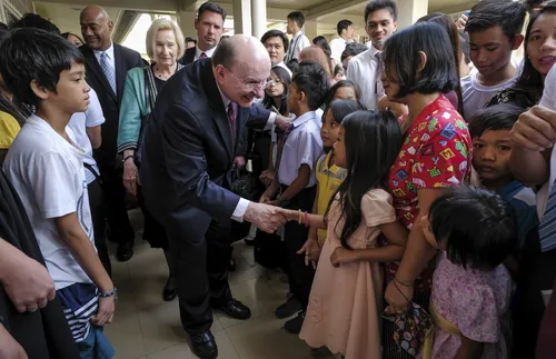 Elder Cook speaking to members