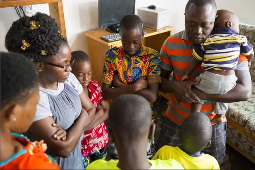 family in Ghana praying