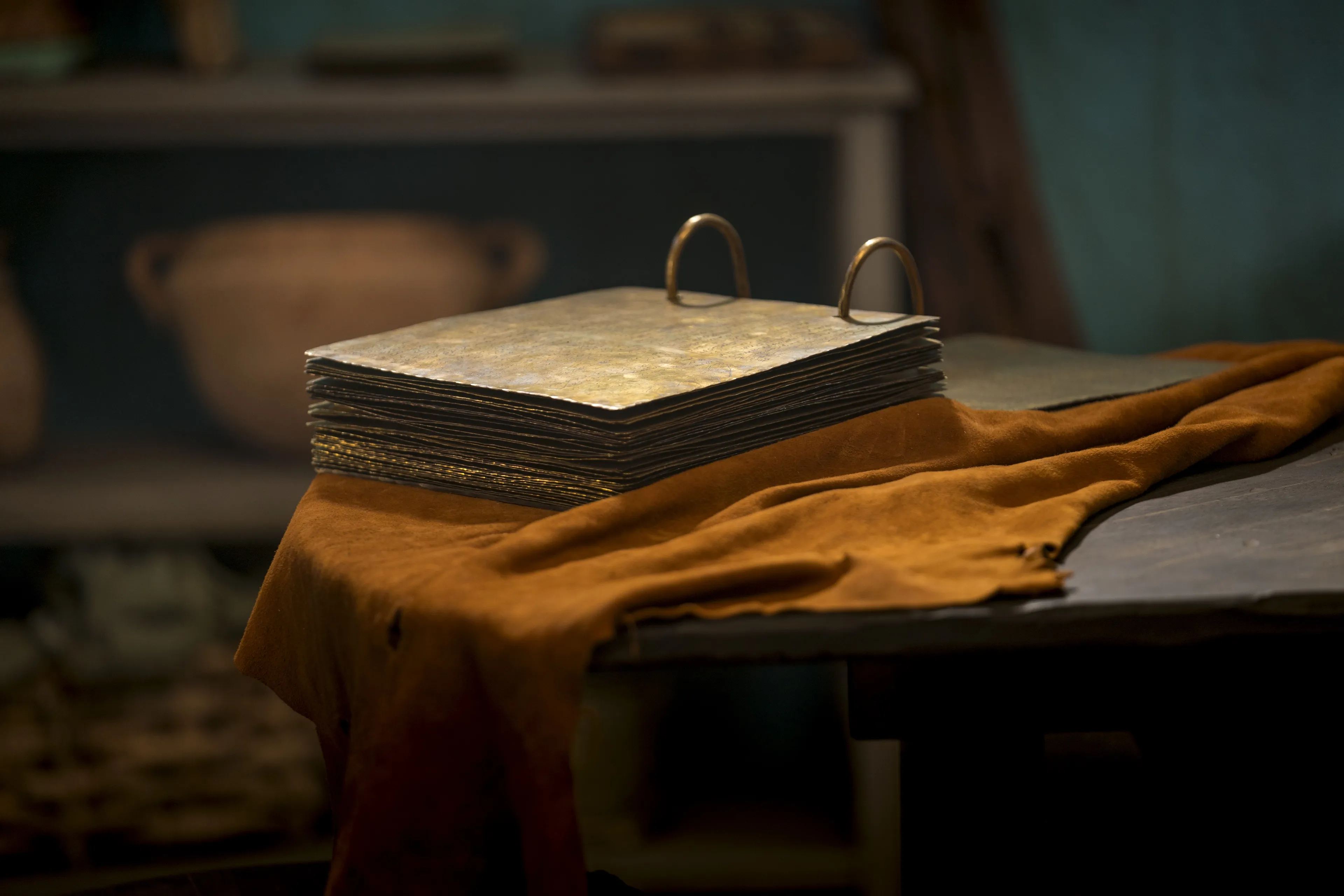 The brass plates sit on a table.