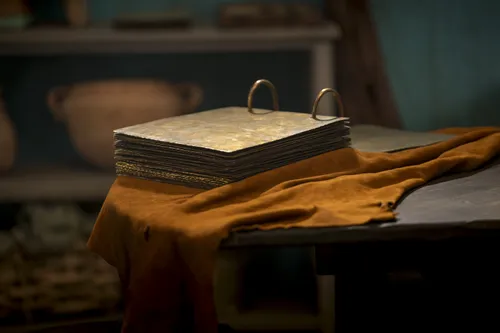 The brass plates sit on a table.