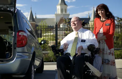 wife and disabled husband in front of temple