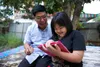 father and daughter on tablet