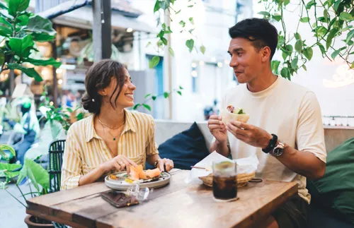 a couple eating and laughing together