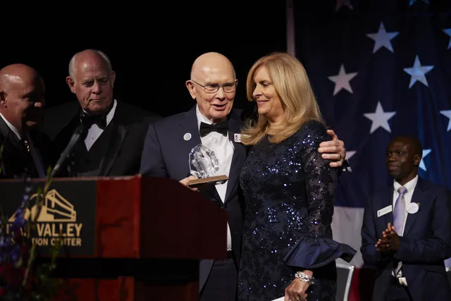 President Dallin H. Oaks of the First Presidency stands with Ruth Todd, emcee for the Freedom Awards Gala, an event of America’s Freedom Festival at Provo, Utah, a local nonprofit, on Thursday, July 1, 2021. He received the award for his lifelong work to promote the values of God, family, freedom and country.