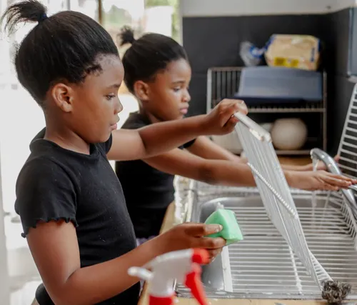 Sisters helping clean at home