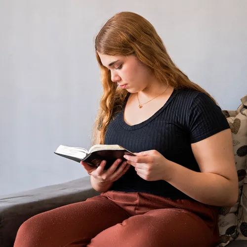 young woman reading scriptures