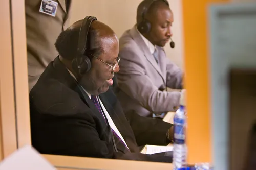 two men in translation booth
