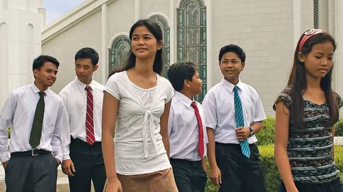 youth walking by temple