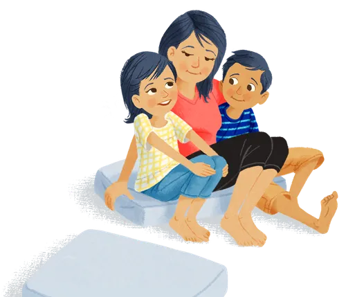 Mom sitting on cushion with daughter and son
