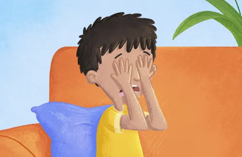 Boy covering his eyes