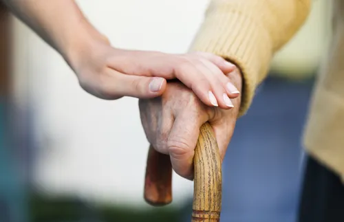 one hand on top of another