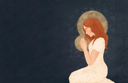 a woman kneeling and praying