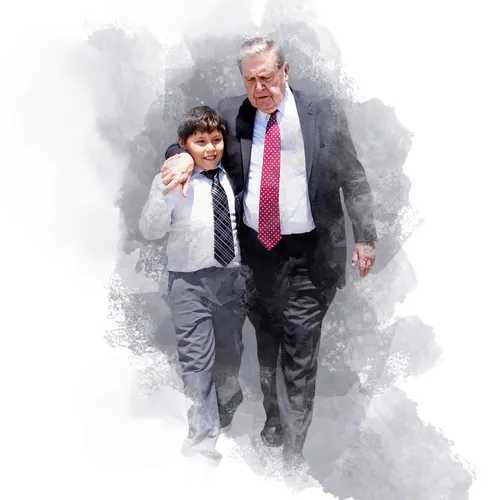 President Holland walking with a young man