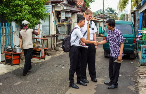missionaries talking to a man on the street