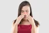 woman touching nose