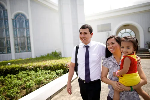 family walking outside of the temple
