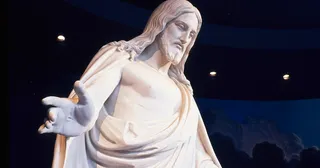 The Christus statue in the Salt Lake North Visitors' Center. The sculpture portrays the resurrected Jesus Christ standing with His arms slightly extended. The wounds of the Crucifixion are visible in the hands, feet and side of the figure. The holdings include details of various parts (such as the hands or feet) of the sculpture.
